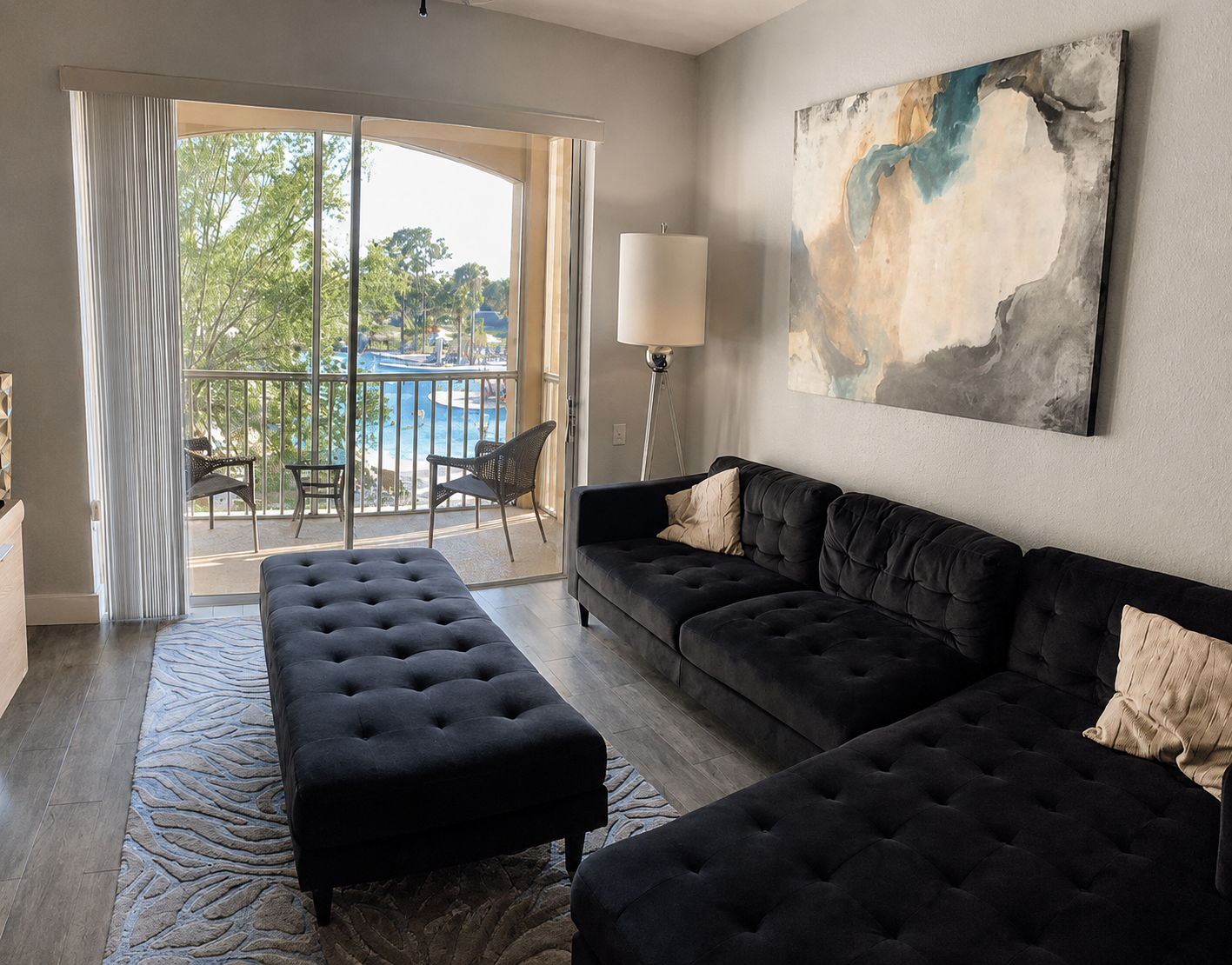 Living room opening onto the private pool-view balcony